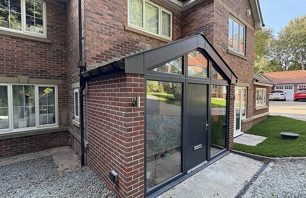 Grey tiles on solid conservatory roof