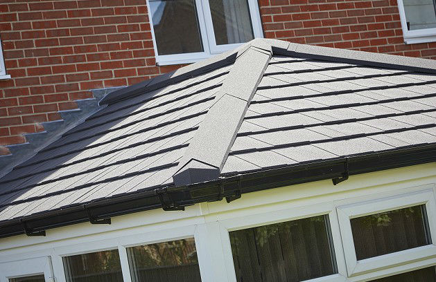 Grey tiles on solid conservatory roof