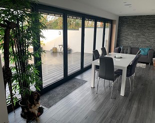 Aluminium bifold doors at night