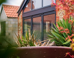 Grey bifold doors on home extension