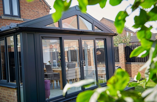 Grey aluminium sliding doors on conservatory