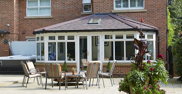 Solid conservatory roof with tiles