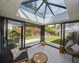 Orangery with patio doors and lantern roof