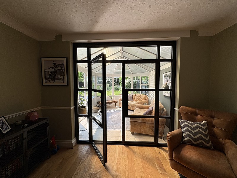 Black aluminium French doors inside a home